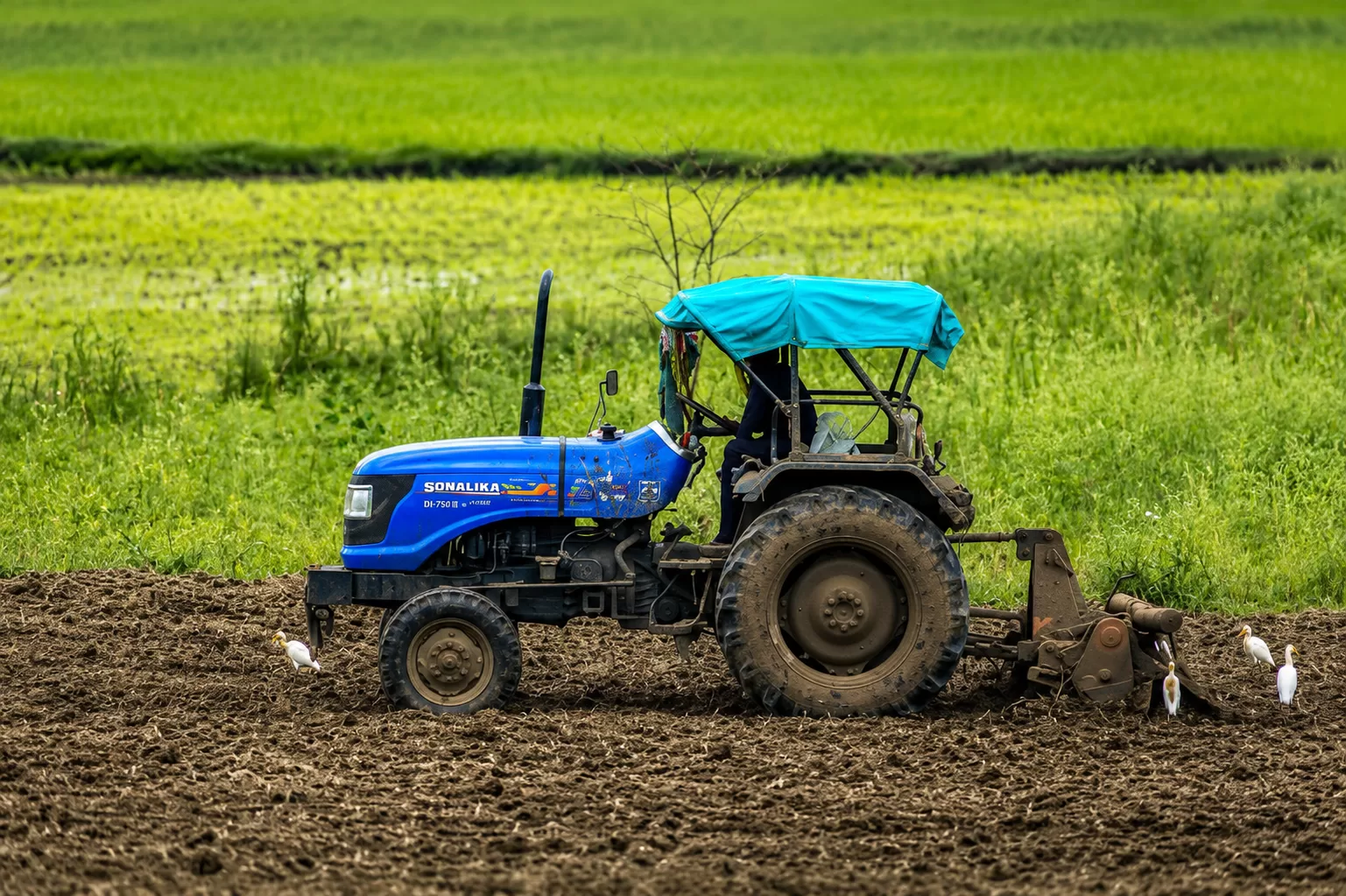 Best tractor in India 2026 farmer driving tractor in field